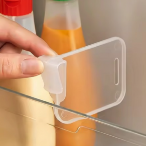 Clear Fridge Side Door Dividers organizing sauce bottles in a refrigerator door.