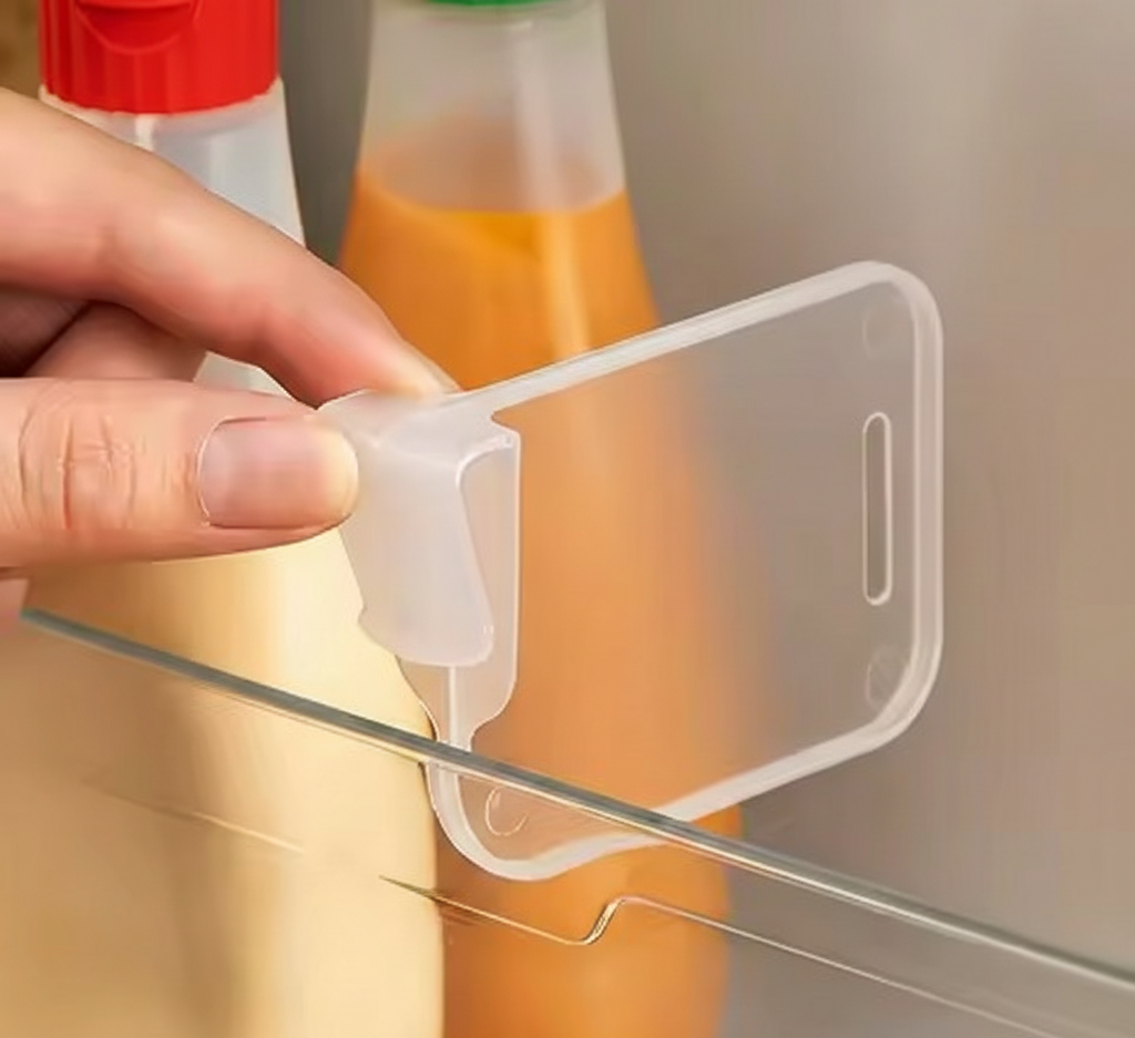 Clear Fridge Side Door Dividers organizing sauce bottles in a refrigerator door.